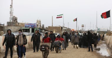 Afghans return to Afghanistan at the Islam Qala border with Iran, in the western Herat Province, Afghanistan, Feb. 20, 2019. (AP Photo)