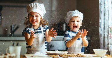 Kids cooking in the kitchen. (Shutterstock Photo)