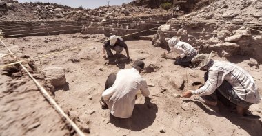 Archaeologists working on a dig. (Shutterstock Photo)