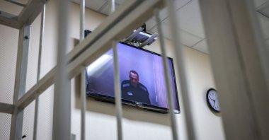 Jailed Kremlin critic Alexei Navalny appears on screen via a video link from prison during a court hearing, at a court in the town of Petushki some 120 kilometers outside Moscow, May 26, 2021. (AFP Photo)