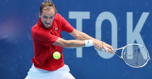 Russia's Daniil Medvedev returns the ball to Italy's Fabio Fognini during their Tokyo 2020 Olympic Games men's singles third round tennis match at the Ariake Tennis Park in Tokyo, Japan, July 28, 2021. (AFP Photo)