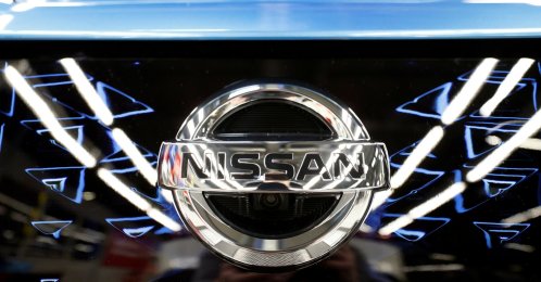 The logo of Nissan is seen on a car ahead of a news conference at Nissan's Sunderland plant in Sunderland, U.K., July 1, 2021. (Reuters Photo)