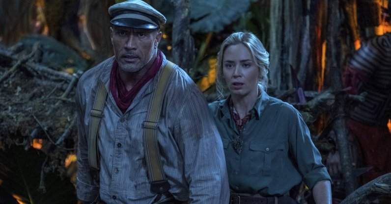 Emily Blunt, right, and Dwayne Johnson in a scene from "Jungle Cruise." (Disney via AP)