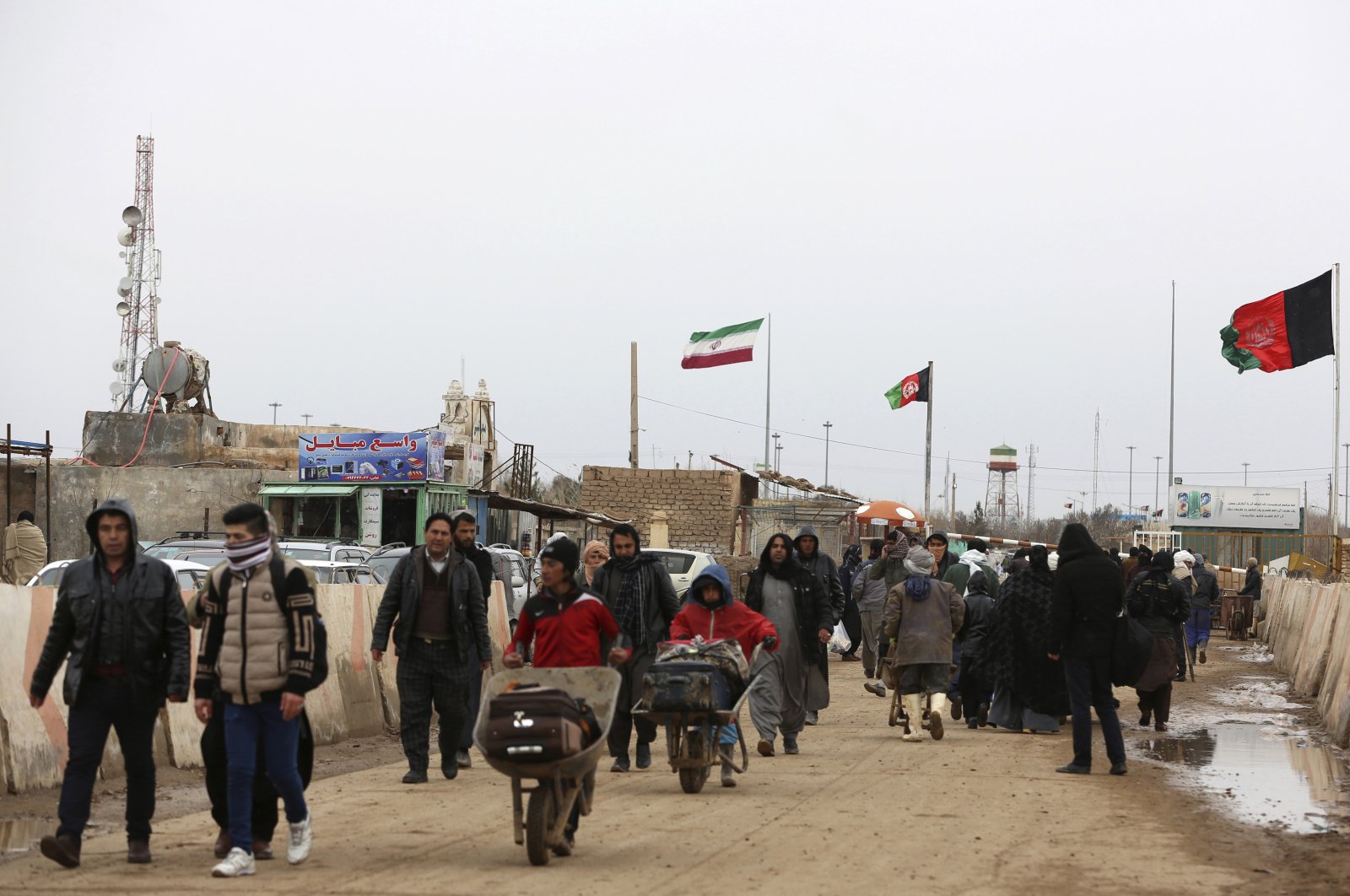 Afghans return to Afghanistan at the Islam Qala border with Iran, in the western Herat Province, Afghanistan, Feb. 20, 2019. (AP Photo)