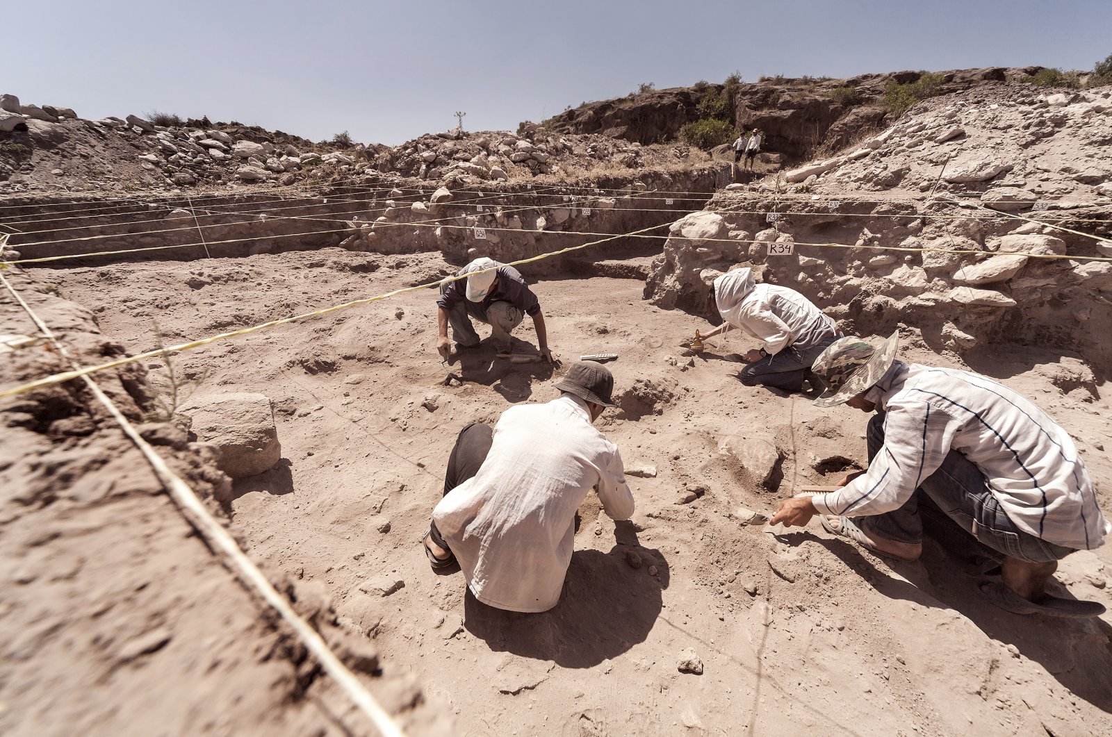 Archaeologists working on a dig. (Shutterstock Photo)