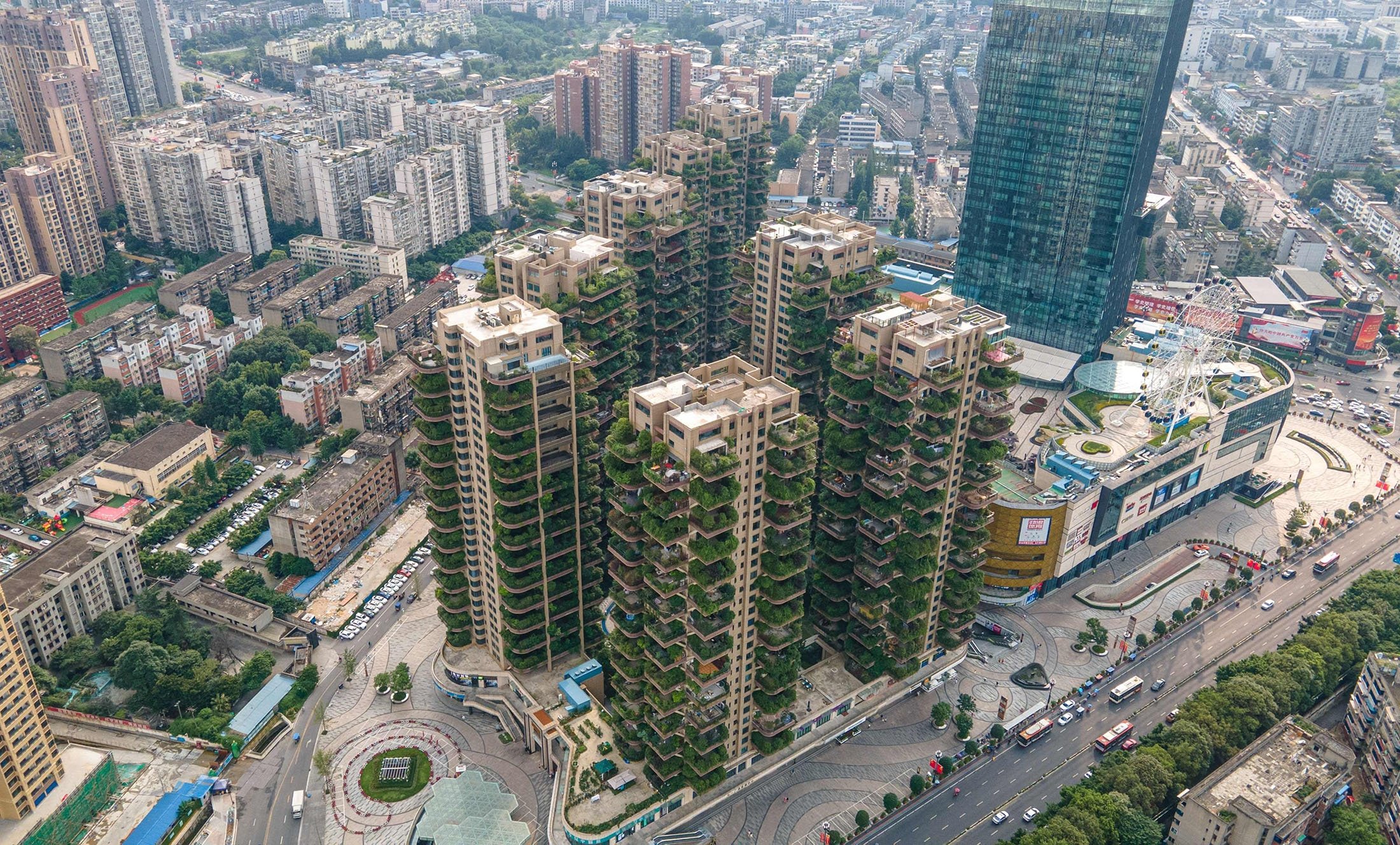 Apartment blocks with balconies covered with plants at a residential community can be seen in Chengdu in China