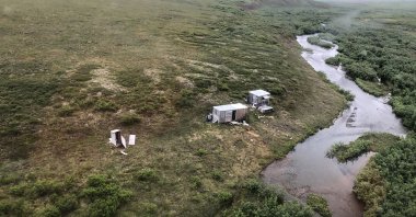 This photo provided by the U.S. Coast Guard District 17 shows a remote mining camp where a Coast Guard Air Station Kodiak aircrew rescued a survivor of a bear attack near Nome, Alaska, U.S., on July 16, 2021. (AP Photo)