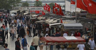 People walk in the Eminönü neighborhood, in Istanbul, Turkey, May 28, 2021. (AP Photo)