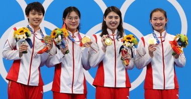 (From L to R) Women's 4 x 200-meter Freestyle Relay gold medallists China's Yang Junxuan, Tang Muhan, Zhang Yufei and Li Bingjie celebrate on the podium, Tokyo Aquatics Centre, Tokyo, Japan - July 29, 2021.