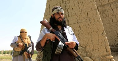 Taliban members walk as they celebrate the cease-fire in the Ghani Khel district of Nangarhar province, Afghanistan, June 16, 2018. (Reuters Photo)