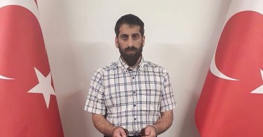 Senior PKK terrorist Cimsit Demir in handcuffs after being caught in a Turkish intelligence operation in this undated photo released July 29, 2021. (AA Photo)