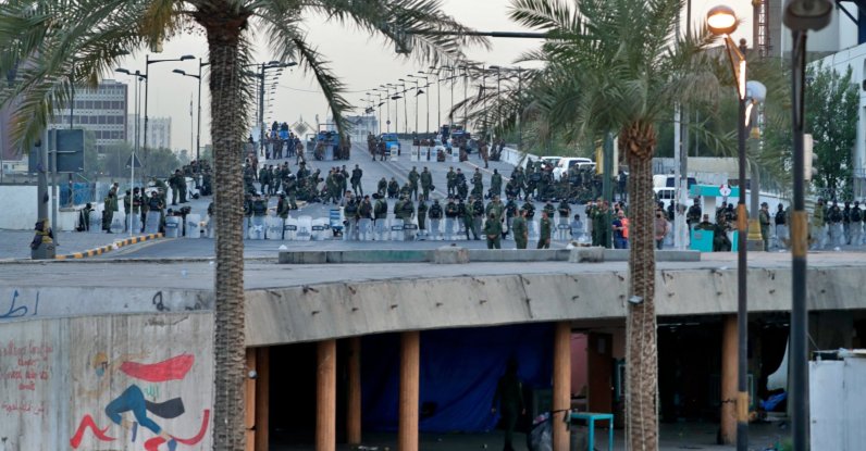 Security forces close the Joumhouriya Bridge that leads to the Green Zone government areas during a protest in Baghdad, Iraq, July 18, 2021. (AP Photo)