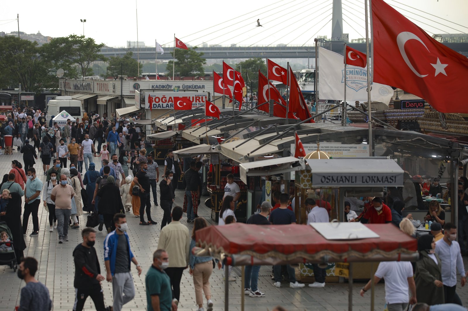 People walk in the Eminönü neighborhood, in Istanbul, Turkey, May 28, 2021. (AP Photo)