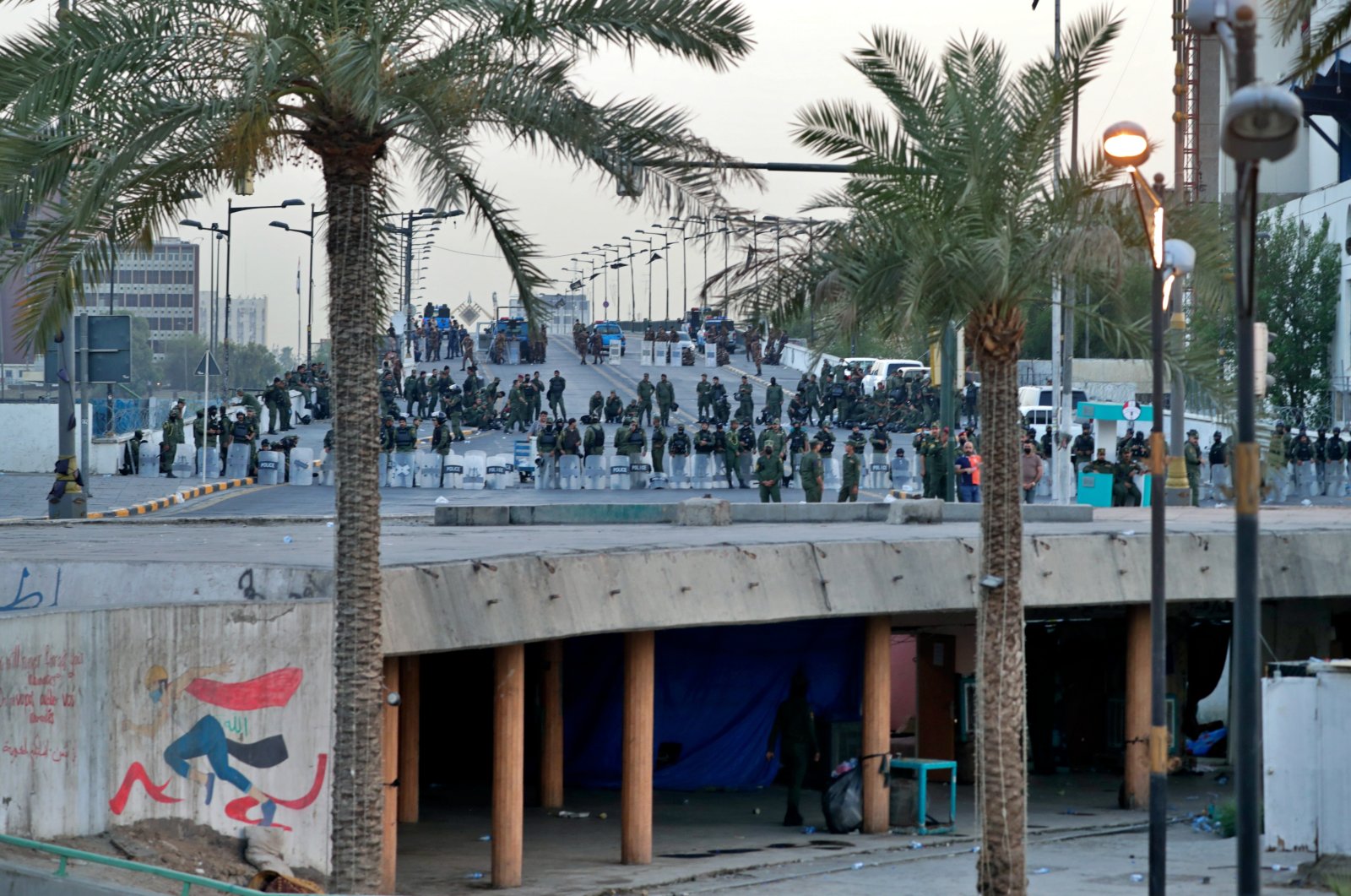 Security forces close the Joumhouriya Bridge that leads to the Green Zone government areas during a protest in Baghdad, Iraq, July 18, 2021. (AP Photo)