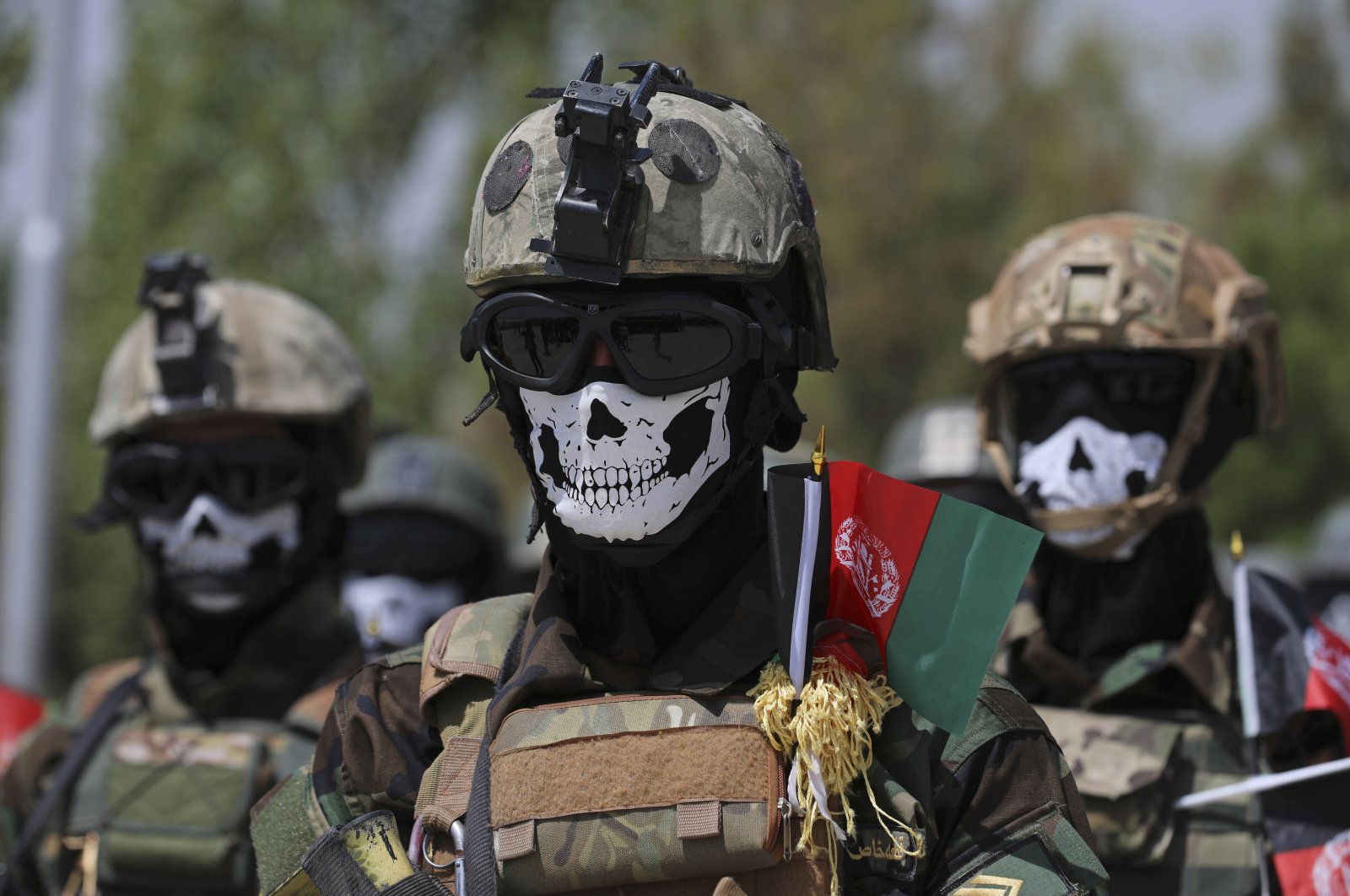 Masked Afghan Army Special Forces attend their graduation ceremony after a three-month training program at the Kabul Military Training Center, in Kabul, Afghanistan. July 17, 2021. (AP Photo)