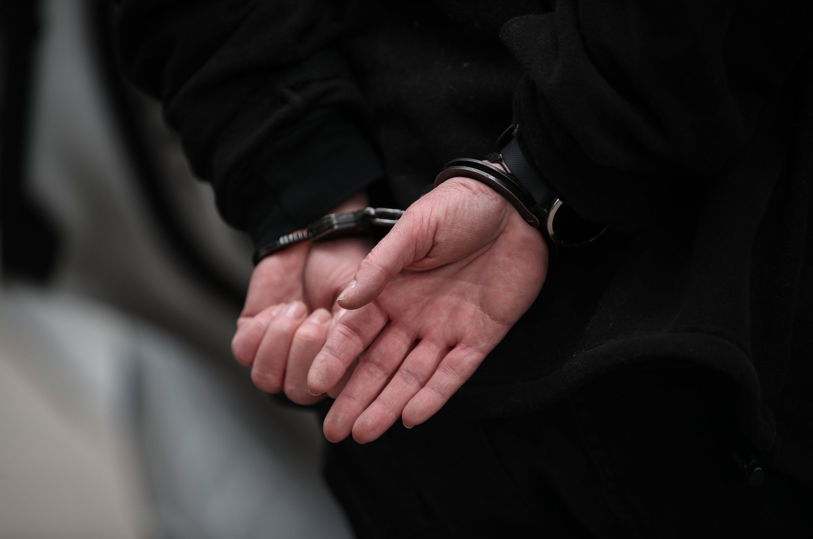 A person in handcuffs is seen in this undated file photo. (AA File Photo)