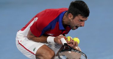 Novak Djokovic, of Serbia, reacts during a semifinal men's tennis match against Alexander Zverev, of Germany, at the 2020 Summer Olympics, Tokyo, Japan, Friday, July 30, 2021. (AP Photo)