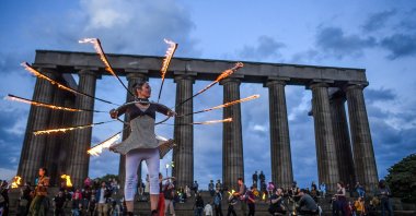Performers from Fire Club Edinburgh mark the summer solstice during a fire festival on Calton Hill, June 21, 2021, Edinburgh, Scottland, U.K. (Getty Images)