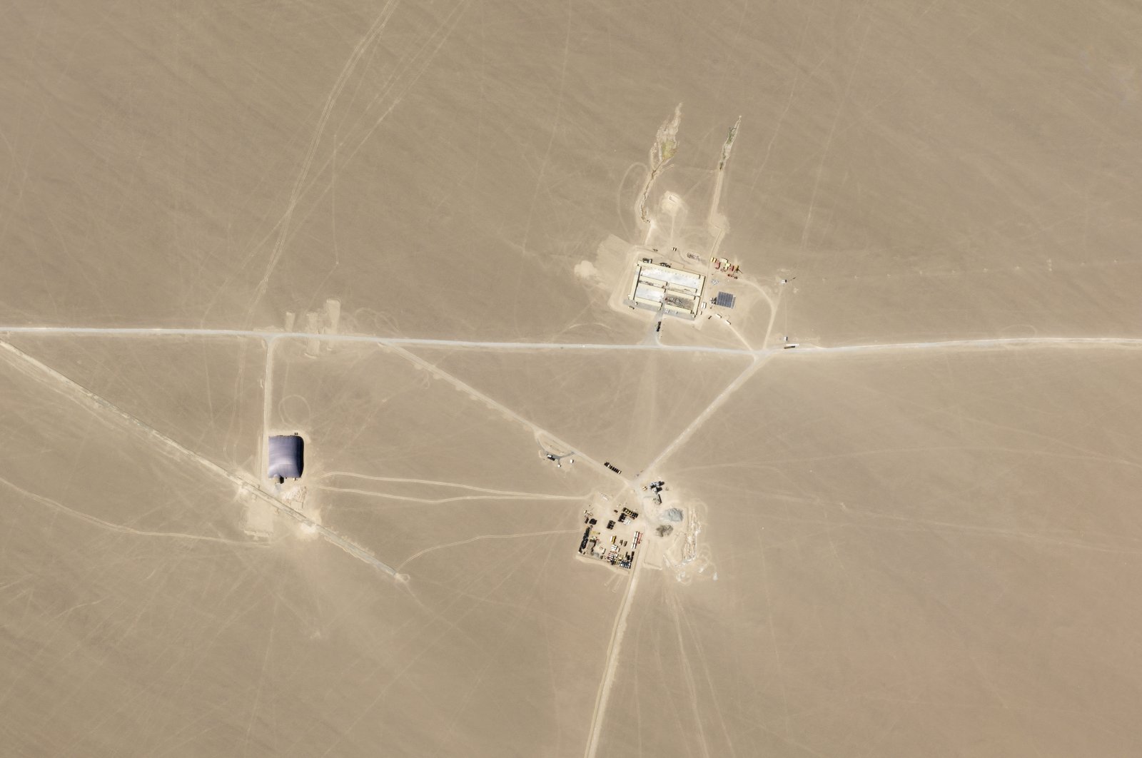 This satellite image shows what analysts believe is construction on an intercontinental ballistic missile silo near Hami, China, July 25, 2021. (Planet Labs Inc. via AP)