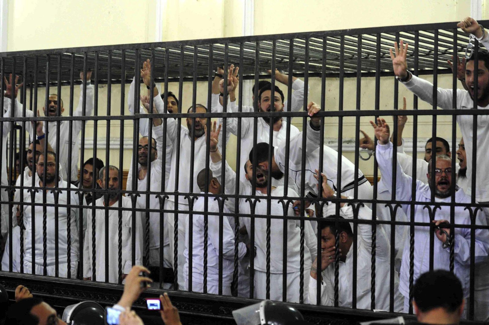 Supporters of the Muslim Brotherhood and ousted President Mohammed Morsi stand trial in Alexandria, Egypt, March 29, 2014. (Reuters Photo)