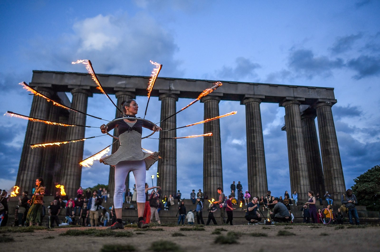Performers from Fire Club Edinburgh mark the summer solstice during a fire festival on Calton Hill, June 21, 2021, Edinburgh, Scottland, U.K. (Getty Images)