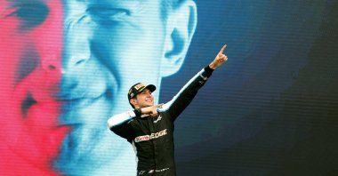 Alpine's Esteban Ocon celebrates on the podium after winning the race, Aug. 1, 2021. (Reuters Photo)