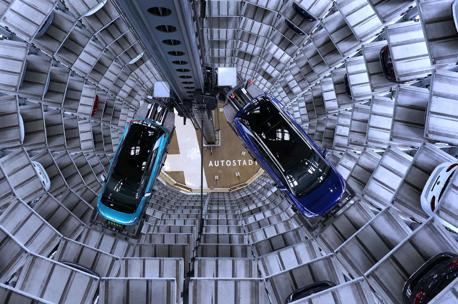 New Volkswagen (VW) ID.4 (right) and ID.3 (left) electric cars are presented at the storage facility auto tower of German carmaker Volkswagen in Wolfsburg, northern Germany, Oct. 26, 2020. (AFP Photo)