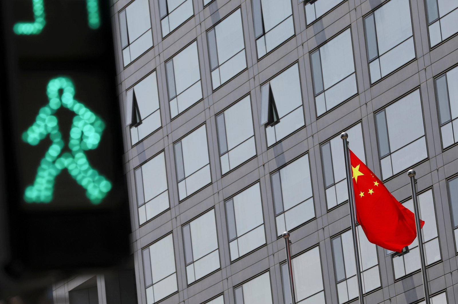 A Chinese national flag flutters outside the China Securities Regulatory Commission (CSRC) building on the Financial Street in Beijing, China, July 9, 2021. (Reuters Photo)