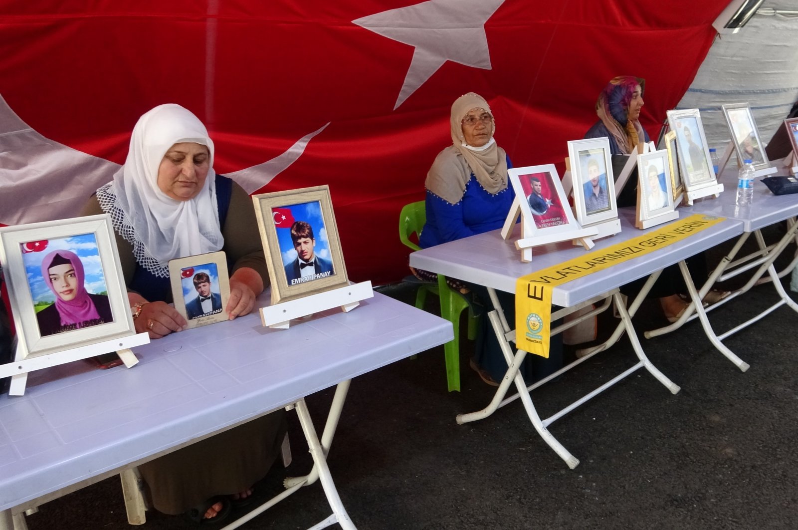 Families protesting the abduction of their children outside the pro-PKK Peoples' Democratic Party (HDP) in southeastern Diyarbakır province, Turkey, Aug. 1, 2021 (IHA Photo)