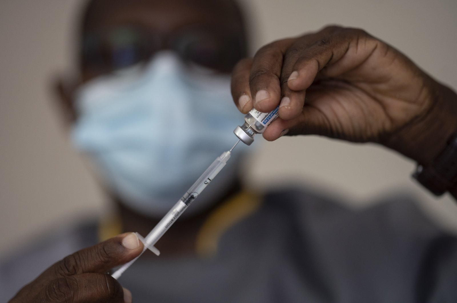 A health worker administers a dose of the Janssen COVID-19 vaccine by Johnson & Johnson in the Medina neighborhood in Dakar, Senegal, on July 28, 2021. (AP Photo)
