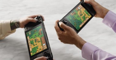 Two people are seen playing Stardew Valley on their Steam Decks in this photo (Credit: Valve)