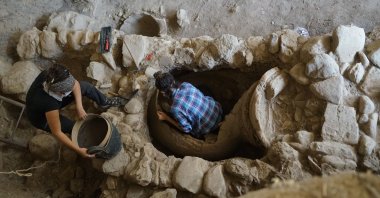 Archaeologists work at the pithos burial in the ancient city of Antandros, Balıkesir, Turkey, July 31, 2021. (AA Photo)