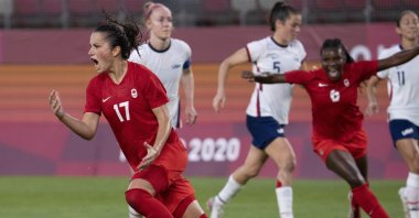 Canada midfielder Jessie Fleming (L) celebrates her game-winning penalty during the women's semifinal match against the USA at the 2020 Summer Olympics, Kashima, Japan, Aug. 2, 2021. (AP Photo)