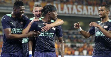 PSV's Noni Madueke (C) is congratulated by his teammates after scoring the opening goal during the Champions League second qualifying round, second leg match against Galatasaray in Istanbul, Turkey, July 28, 2021. (AP Photo)