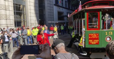 Mayor London Breed welcomes people to the city's cable car service's return during a ceremony at the Powell Street turnaround plaza in San Francisco, U.S., Monday, Aug. 2, 2021. (AP Photo)