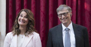 In this April 21, 2017, file photo, philanthropist and co-founder of Microsoft, Bill Gates (R), and his now ex-wife Melinda react, prior to being awarded the Legion of Honour at the Elysee Palace in Paris.   (AP Photo)