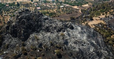 An aerial view shows a ravaged area and burnt trees in the Marmaris district of Muğla, Turkey, Aug. 3, 2021. (AFP Photo)