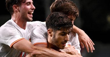 Spain defender Juan Miranda (R) and forward Javier Puado celebrate with midfielder Marco Asensio (C) after scoring the only goal during the Tokyo 2020 Olympic Games men's semifinal match against Japan at Saitama Stadium, Saitama, Japan, Aug. 3, 2021. (AFP Photo)