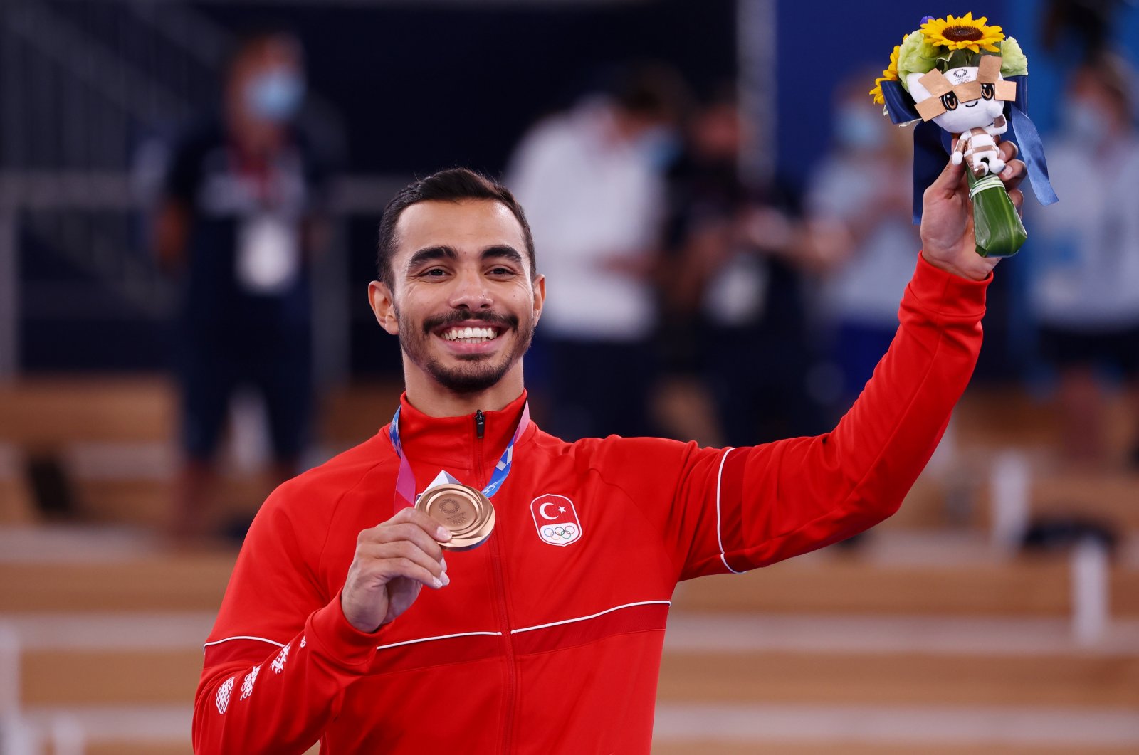 Turkey's Ferhat Arıcan celebrates winning bronze in men's parallel bars at the Tokyo 2020 Olympics, Ariake Gymnastics Centre, Tokyo, Japan, Aug. 3, 2021. (Reuters Photo)