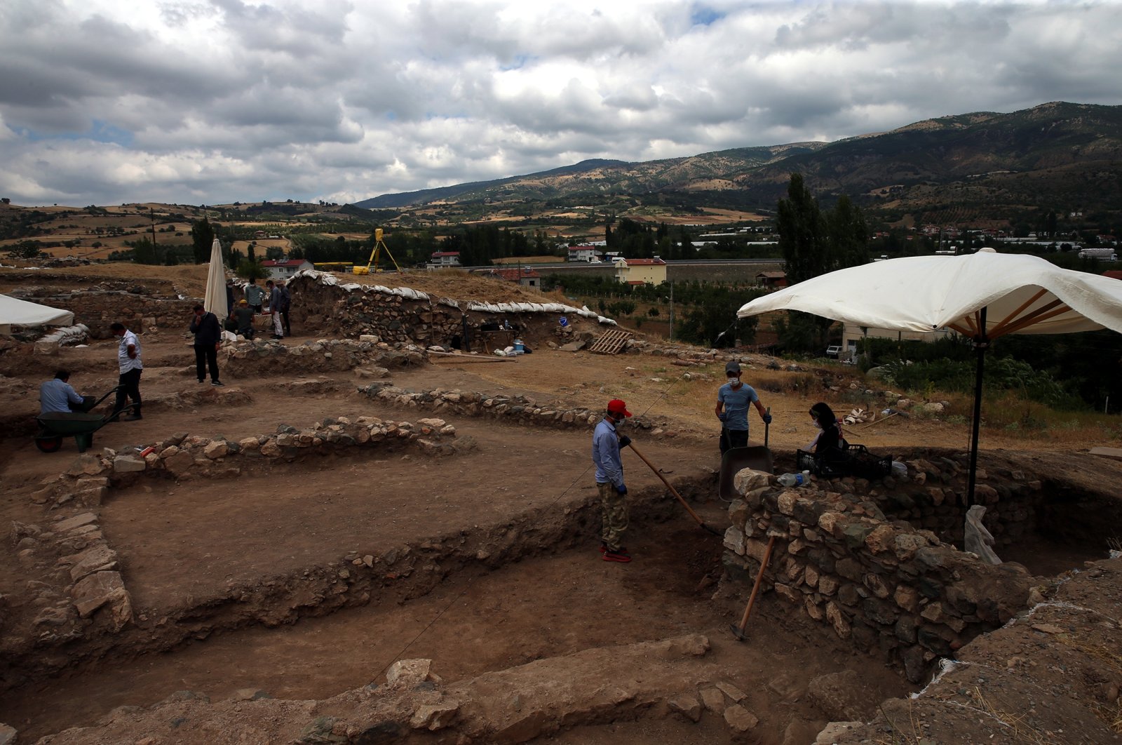 An archaeological team works on the historical remains of the ancient city of Comana Pontica, in Tokat, Turkey, Aug. 2, 2021. (AA Photo)