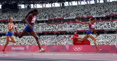 U.S. hurdler Sydney McLaughlin (R) crosses the finish line to win 400-meter hurdles gold at the Tokyo 2020 Olympics, Olympic Stadium, Tokyo, Japan, Aug. 4, 2021. (Reuters Photo)