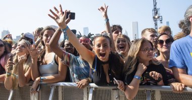 Festival goers seen on day four of the Lollapalooza Music Festival, Sunday, Aug. 1, 2021, at Grant Park in Chicago. (AP Photo)