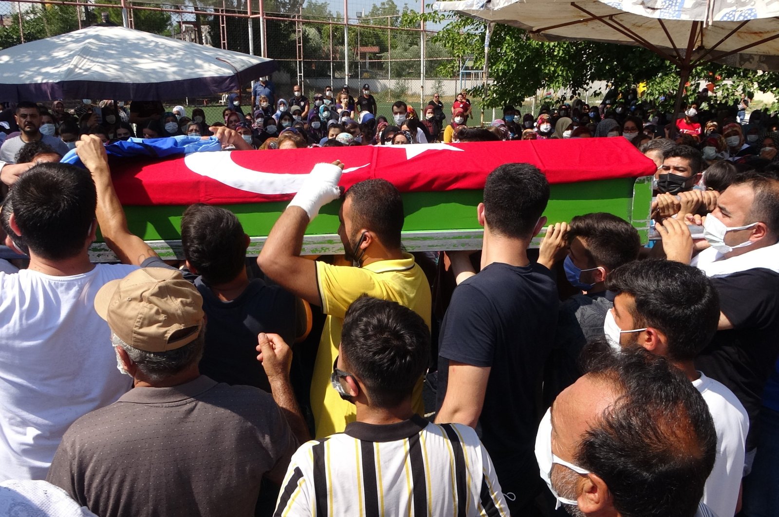 People carry the coffin of A.G.H, in Osmaniye, southern Turkey, Aug. 4, 2021. (İHA PHOTO) 