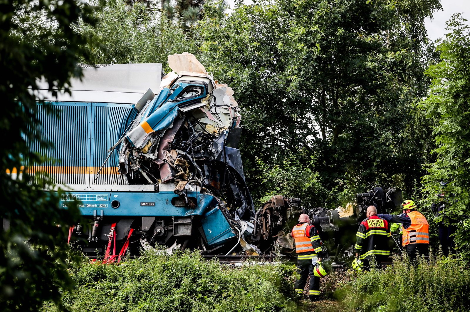 Rescuers secure the scene of a train crash near the city of Domazlice, Czech Republic, Aug. 4, 2021. (EPA Photo)