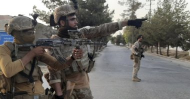 Afghan Special forces patrol a deserted street during fighting with Taliban fighters, in Lashkar Gah, Helmand province, southern Afghanistan, Aug. 3, 2021. (AP Photo)