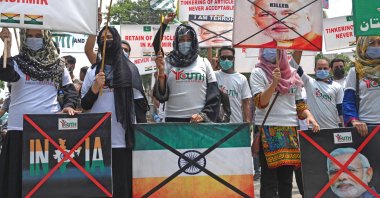 Activists from the "Youth Forum for Kashmir" carry placards to show solidarity with the Kashmiri people during a rally on the second anniversary of the abrogation of Article 370, Lahore, Pakistan, Aug. 5, 2021. (AFP Photo)