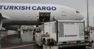 Temperature-controlled containers carrying China's Sinovac COVID-19 vaccines are loaded onto a Turkish Cargo plane at Atatürk airport before departing to Brazil, in Istanbul, Turkey, Nov. 18, 2020. (Turkish Airlines via Reuters)