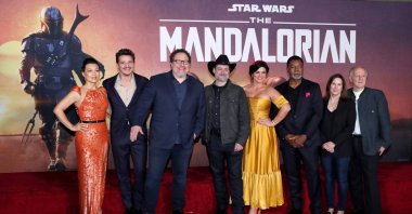 Creator Jon Favreau (3rd L), President of Lucasfilm Kathleen Kennedy (2nd R), executive producer Dave Filoni (C) pose with cast members (L-R) Ming-Na Wen, Pedro Pascal, Gina Carano, Carl Weathers and Werner Herzog at the premiere for the television series "The Mandalorian" in Los Angeles, California, U.S., Nov. 13, 2019. (Reuters Photo)