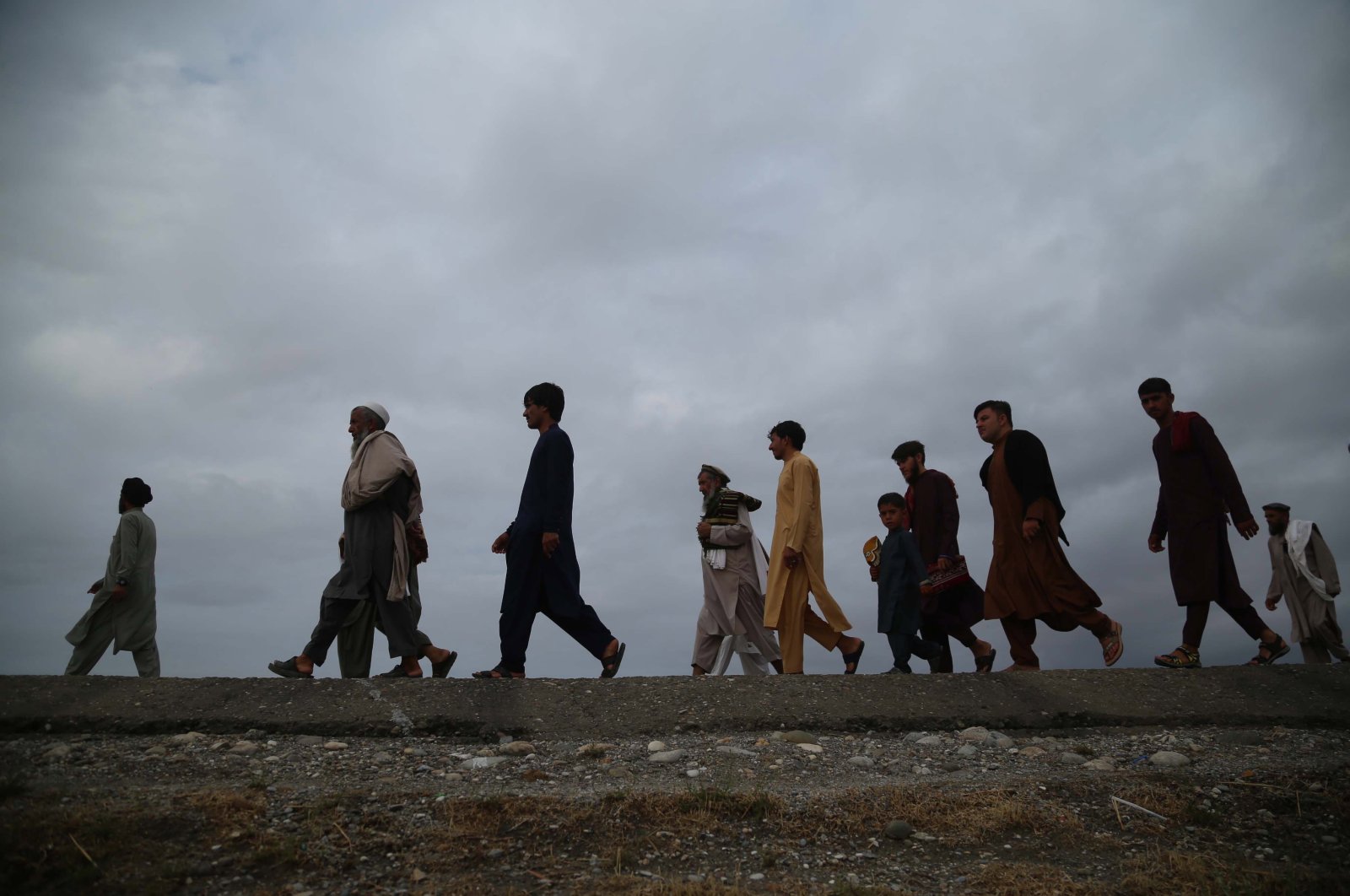 Afghans arrive to offer Qurban Bayram, also known as Eid al-Adha, prayers in the Sarhood district of Nangarhar province, Afghanistan, July 20, 2021. (EPA Photo)
