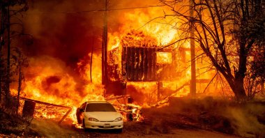 A home is engulfed in flames as the Dixie fire rages on in Greenville, California, U.S., Aug. 5, 2021. (AFP Photo)
